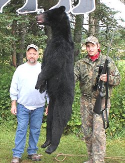 Father and son bear hunting partners with son&#39;s first trophy bear at Foggy Mountain Guide Service