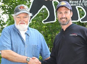 Wayne Bosowicz with pistol champion Doug Koenig